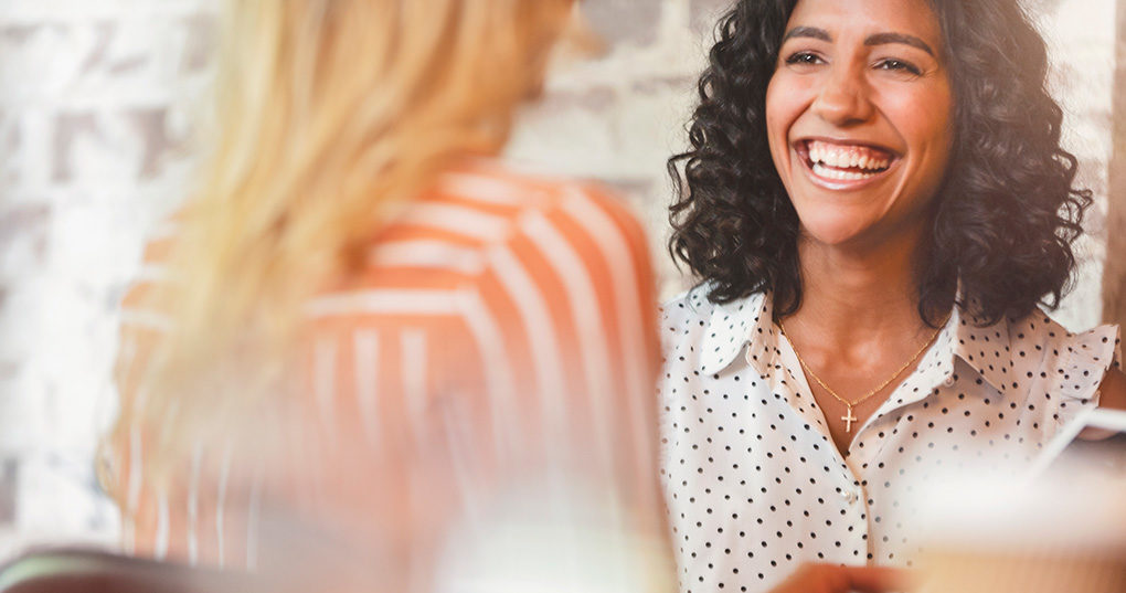 Two women talking.