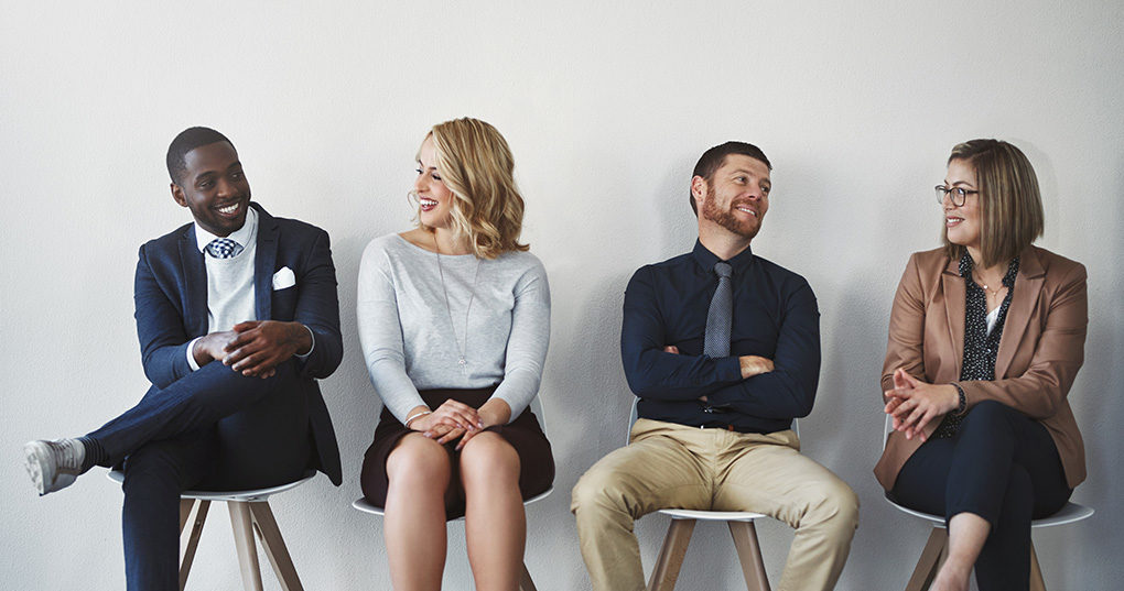 Four job applicants sitting.