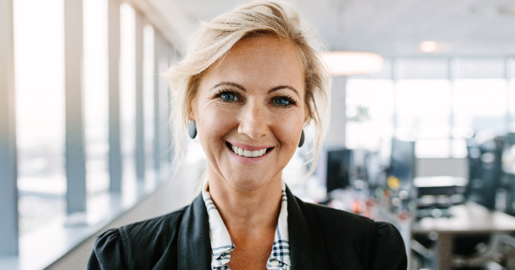 A businesswoman standing in her office